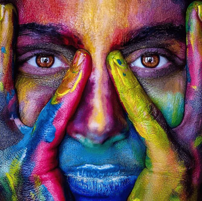 image persons face painted with multiple colors